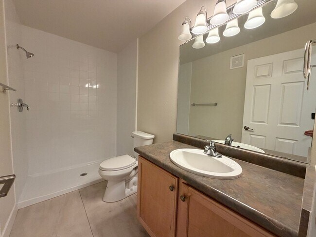 Building Photo - Remodeled Top-Level Condo in Pool Community Near Shopping & Dining