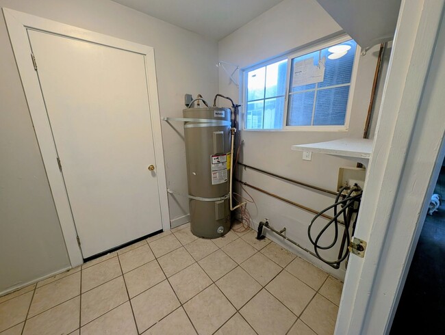 Building Photo - 4-bedroom house with a 2-car garage availa...