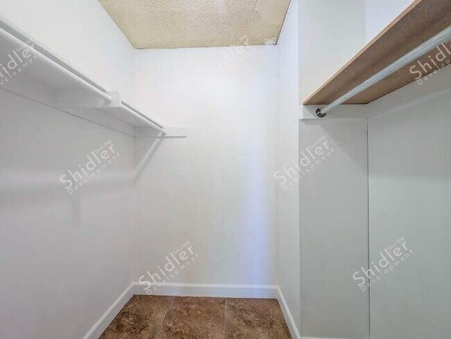Building Photo - Upstairs 2 Bedroom 1 Bath with Massive Walk In Closet, Covered Gated Parking