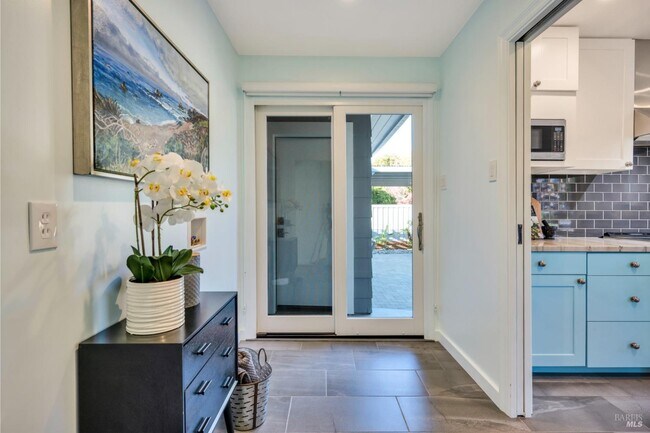 large laundry room with sliding door access to garage & yard - 163 California Ave