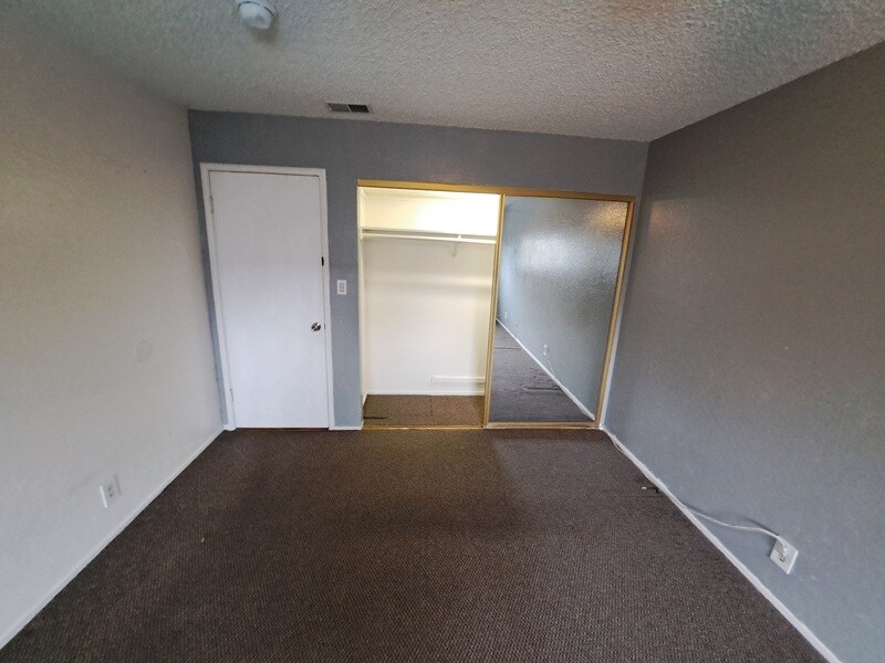 master bedroom and second closet in addition to the walk in closet - 5517 Fiesta Rd