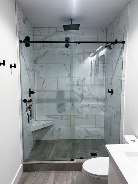 Tile shower with standard and rain head options - 1819 Baltimore Ave