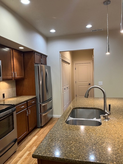 Hallway with new LG Washer and Dryer just off kitchen with plenty of folding space - 5020 W Targee St