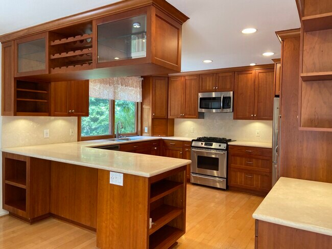 Kitchen, with bar-height peninsula, overhead rack - 1270 Bryant Pl