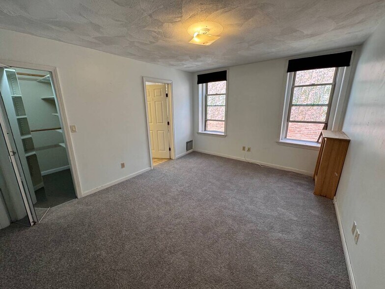 Primary Bed/Walk-In Closet - 154 Harvard St
