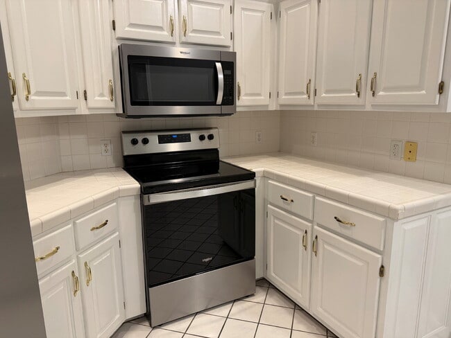 Building Photo - Elegant, Low Maintenance Townhome Designed for Elevated Everyday Living!