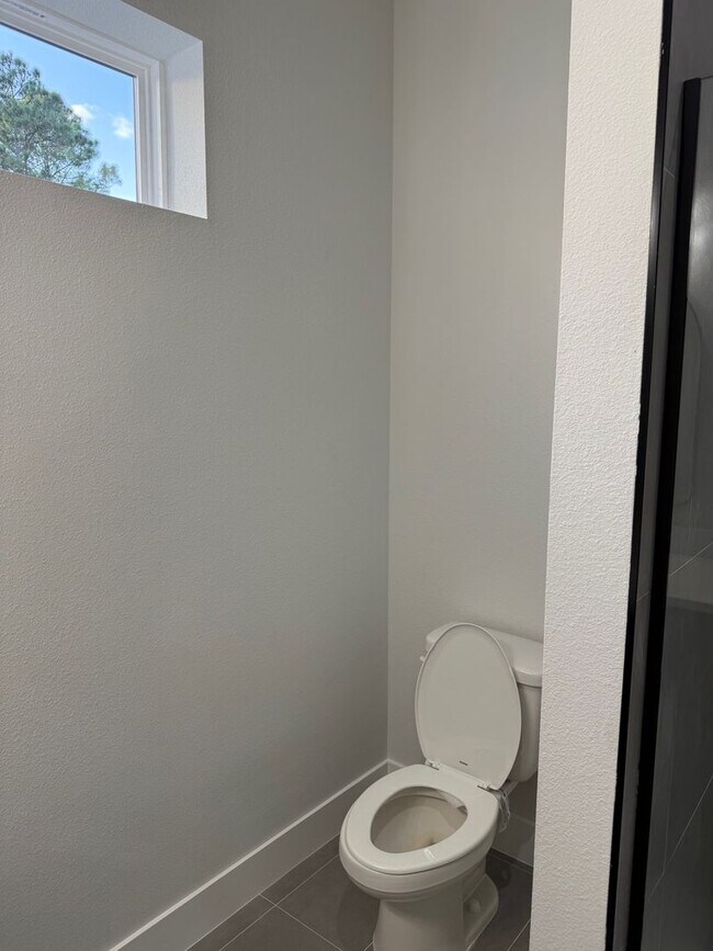 Building Photo - Brand new 3/2/2 with fenced in yard and a screened in porch!