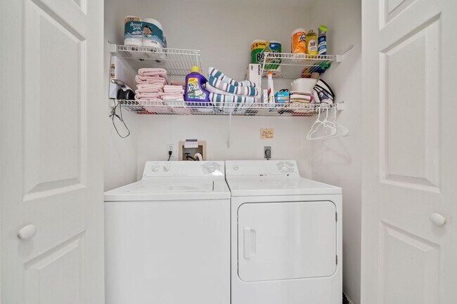 Building Photo - first-floor unit featuring a 2 bedroom, 2 bath fully furnished