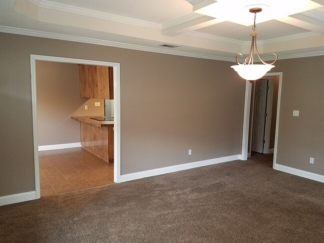 Building Photo - Spacious 3BR Brick Home with Open Split Floor Plan & Tiled Back Porch on Nearly an Acre