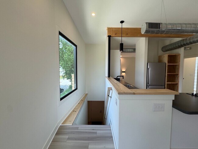 Building Photo - Vaulted Ceilings & Hardwood Floors in This Charming Indianapolis L