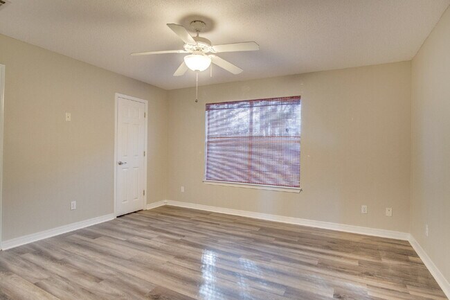 Building Photo - Live the Gulf Breeze Waterfront Life – Dock, Canal Access & Boat Lift!