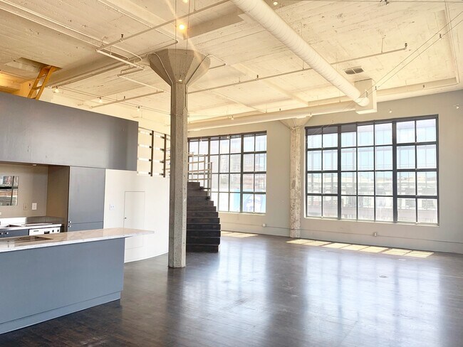 Building Photo - STUNNING LARGE CORNER LIVE/WORK 1 BED+ DEN...