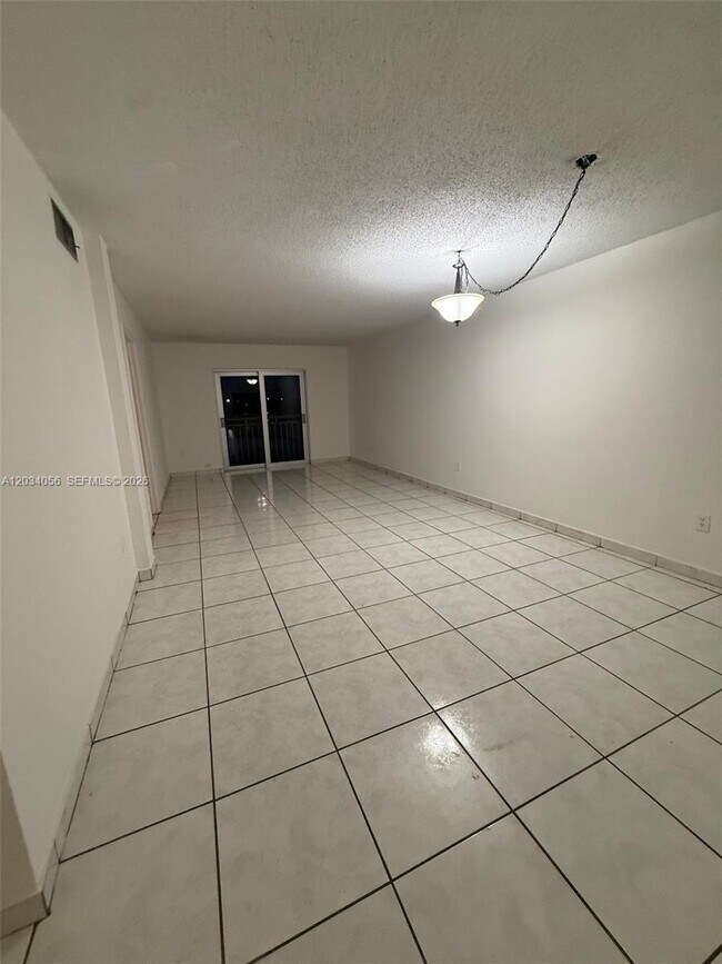 Building Photo - 9917 W Okeechobee Rd
