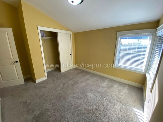 Building Photo - Spacious townhome with private backyard, garage parking, multiple decks, and a dedicated home off...