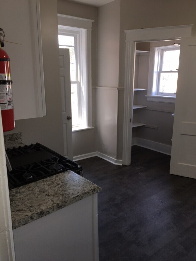 Walking into kitchen viewing pantry - 641 Main St