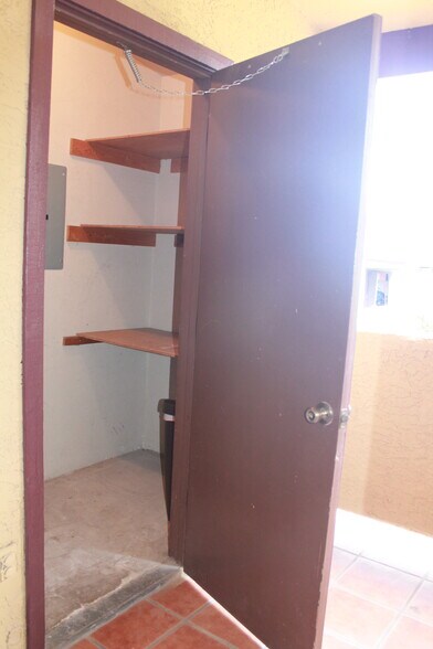Porch storage closet with shelving - 2188 N Pantano Rd