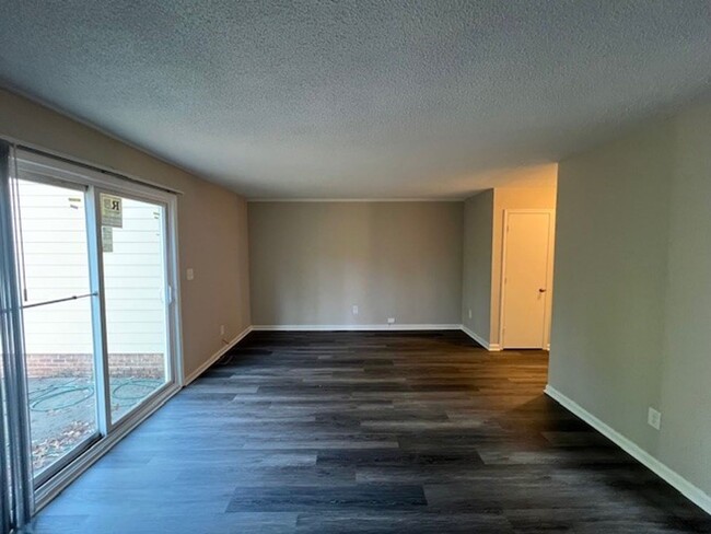 Building Photo - Beautiful Townhome with New LVP Floors and...