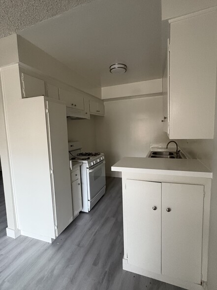 kitchen with stove - 9029 Orion Ave