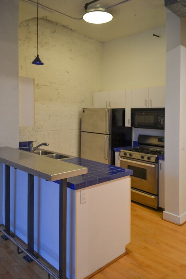 Building Photo - North Park Lofts - Historic Pearl District Warehouse Studio w/parking/most utilities/rooftop patio