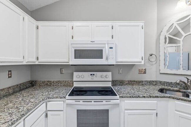 Building Photo - NW - Updated Home with Granite Counter-tops, Fire Place, Deck, Storage Building, Garage!