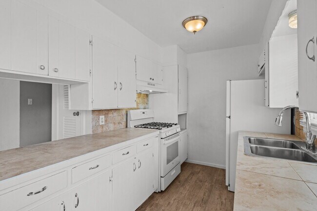 Building Photo - Updated Home with Gorgeous Floors & Large Backyard