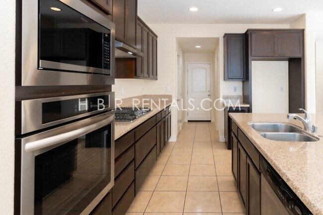 Building Photo - Spacious 4-Bed, 3-Bath Home with a Beautiful Garden in Mountain House! *FIRST FLOOR BEDROOM and F...