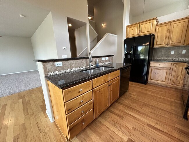 Building Photo - $500 Off First Month Of Rent! Modern 3BR Townhome with Fenced Yard & Garage