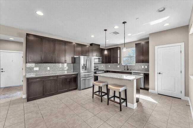 Building Photo - 4-Bedroom Tuscany Townhome with Strip & Golf Course Views