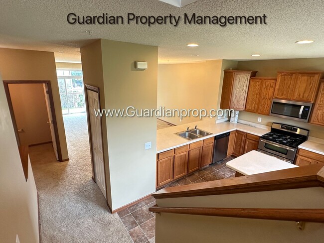 Building Photo - Pet Free Champlin Town Home, 3.5 Baths, 2 Car Garage, Dishwasher, Balcony, Available end of April