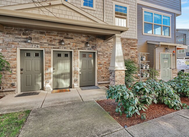 Building Photo - 2BR + 2.1BA Corner Townhome-Style Condo — Dual Primary Suites, Attached Garage & Most Utilities I...