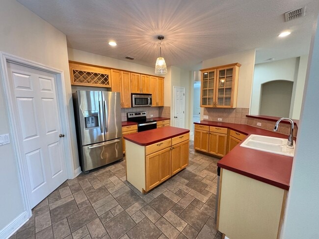 Building Photo - Spacious 4-Bedroom Home with Private Pool and Modern Comforts