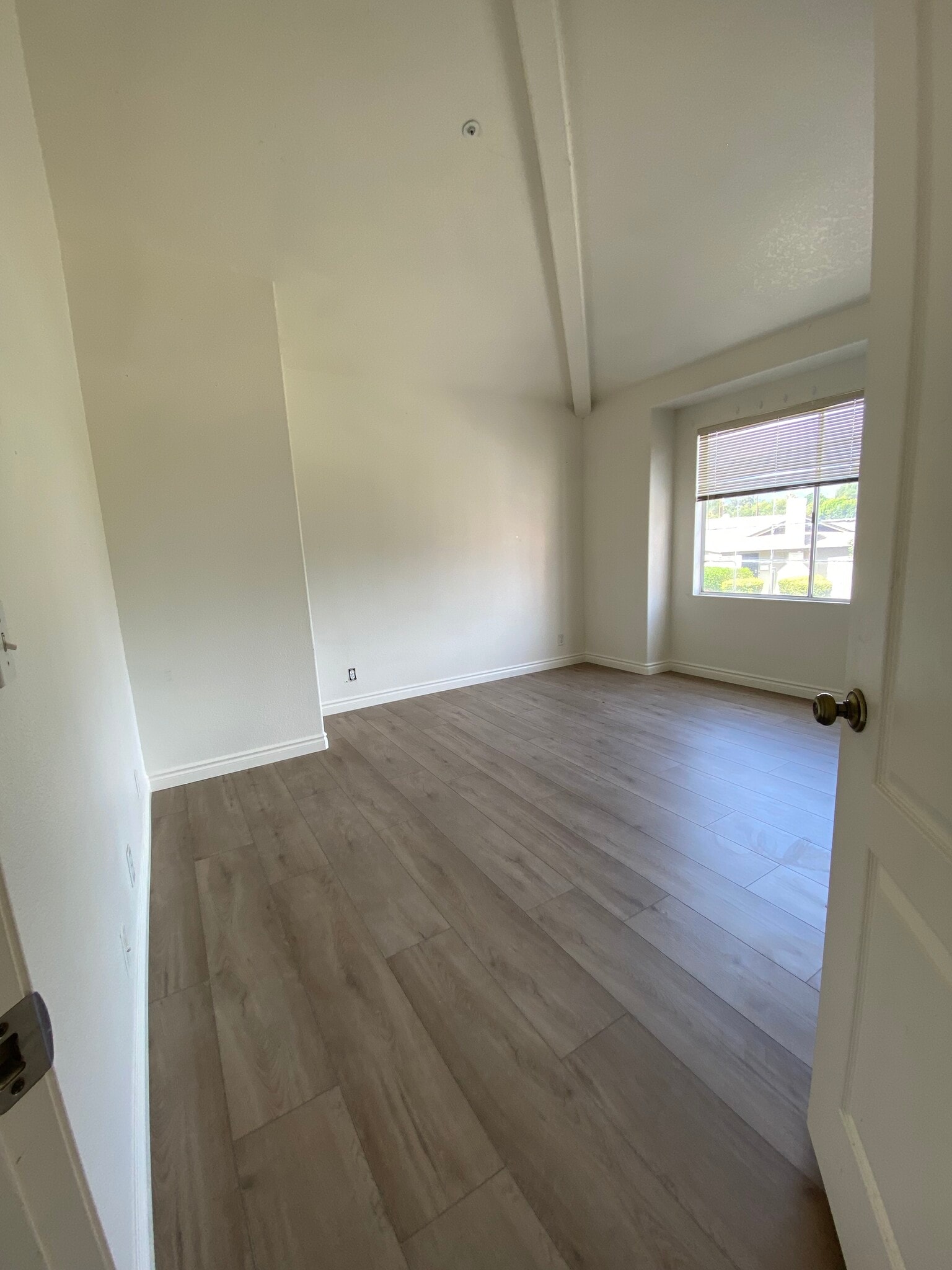 Bedroom 3 with brand new flooring and paint - 915 W Arrow Hwy