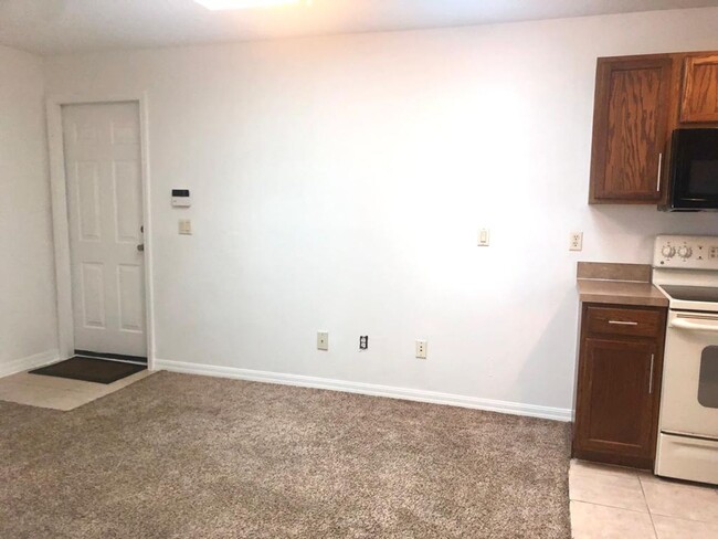 Building Photo - MOVE IN NOW! RENT INCLUDES ELECTRICITY, WA...