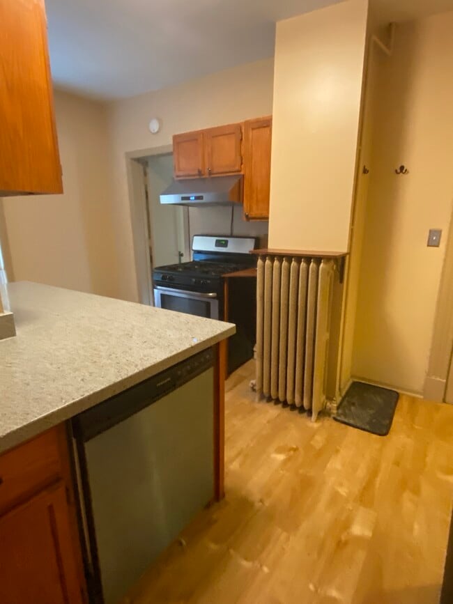 The second bedroom is off the kitchen as is the basement shared laundry. - 3452 Nicollet Ave