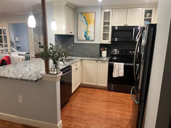 Fully updated kitchen with granite countertops, new appliances - 2440 16th St NW