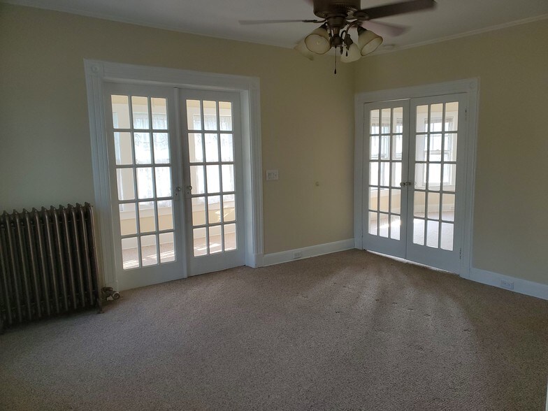Frech doors in living room - 78 S Carll Ave
