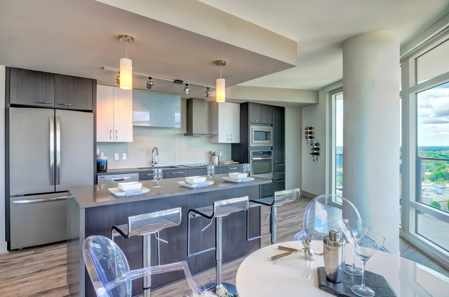 Kitchen with island and stainless steel appliances - Adaire