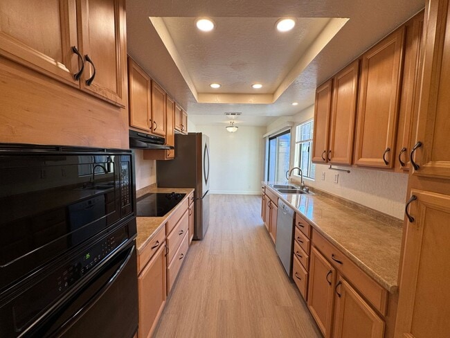 Building Photo - Tastefully updated 2 bedroom/2 bath, single level townhome w/attached 2 car garage!