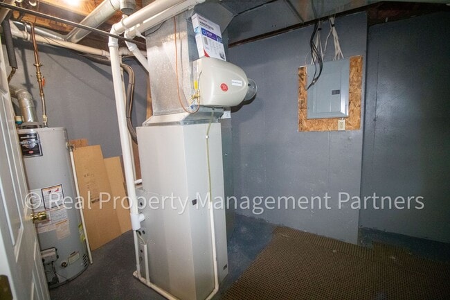 Building Photo - Forest Hills 3 Bed Townhome with Garage, Pond View and Some Utilities Included