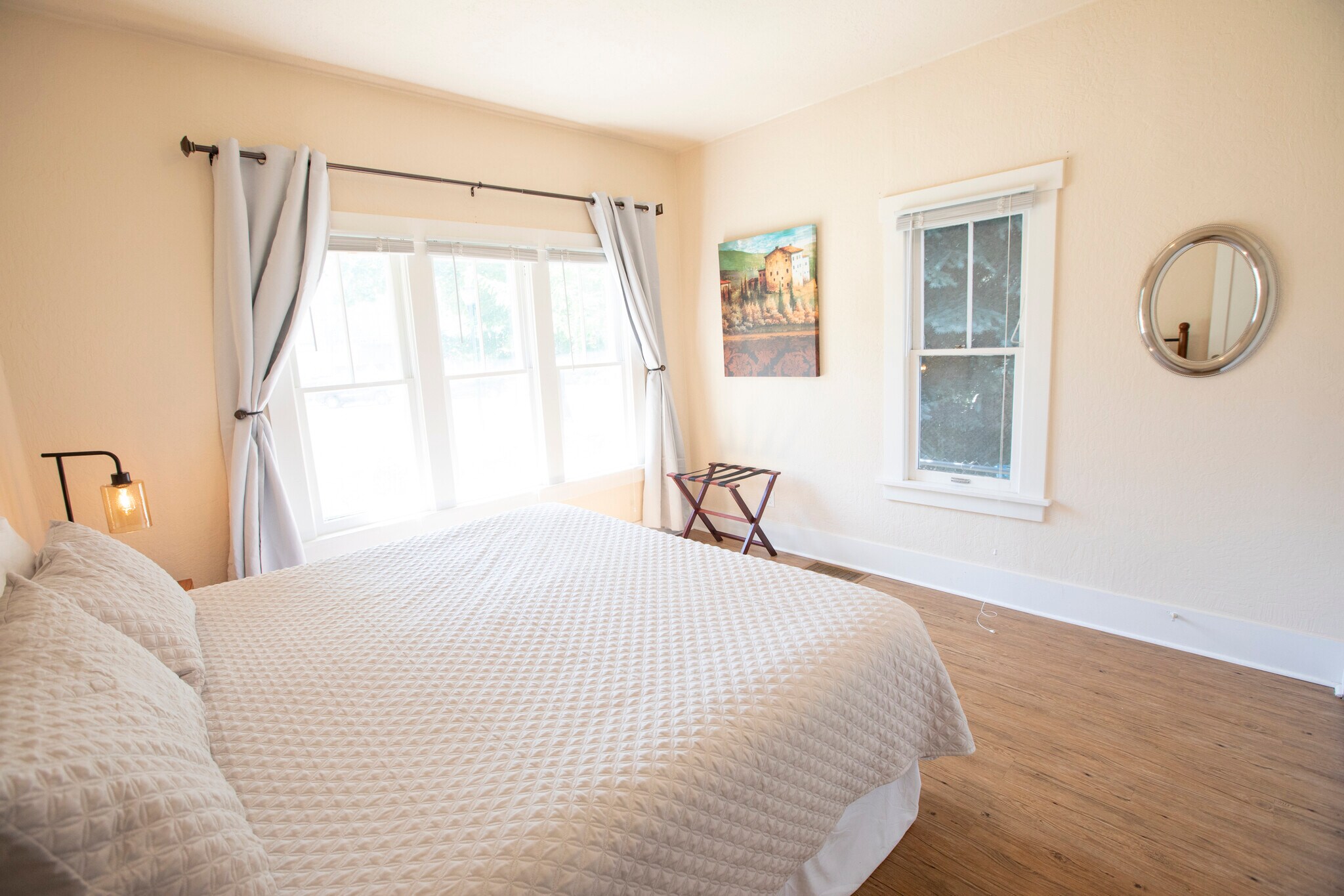 Downstairs master bedroom with King size bed. Blackout curtains and large closet. - 717 E Lakeside Ave