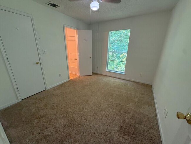 Building Photo - Top floor 4 bed 4 bath condo! On Wolfline, perfect for roommates!