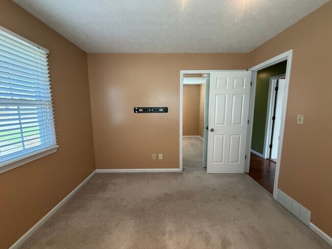 Building Photo - Goodyear Heights Gem with Fireplace, Attached Garage & Massive Backyard