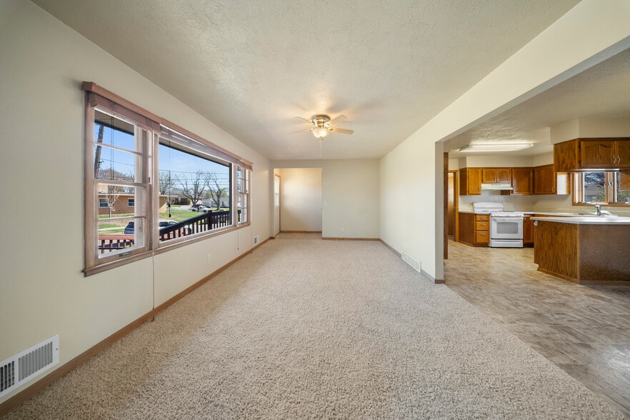 Front main living open to kitchen and dining - 2405 W 28th St