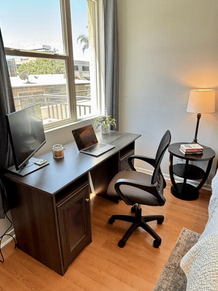 Quiet, sunlit desk setup — perfect for remote work or study. - 3687 4th Ave
