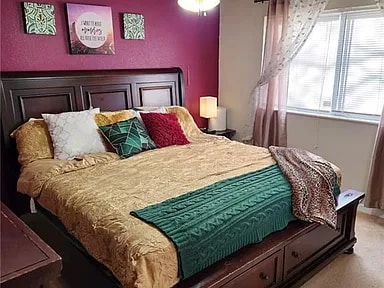 Master Bedroom with a grape accent wall - 5377 Flotron Dr