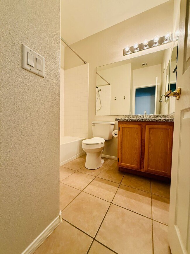 Building Photo - Immaculate and Inviting Two-Story Condo in...