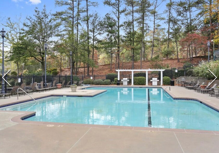 Resort-style community pool with sundeck and grilling areas - 795 Hammond Dr