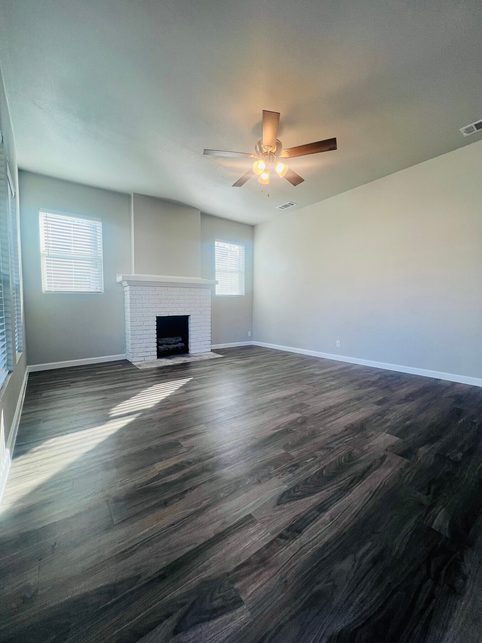 Fireplace in Living Room, Brand New Vinyl Plank Flooring, New 2” Faux Wood Blinds Throughout House - 822 W Fischer St