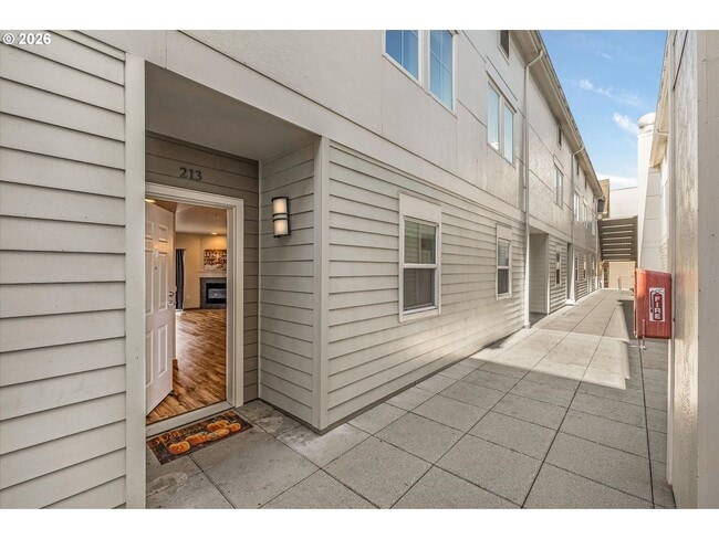 Building Photo - Main Street Living with Granite Kitchen, Gas Fireplace, and MAX Line Access