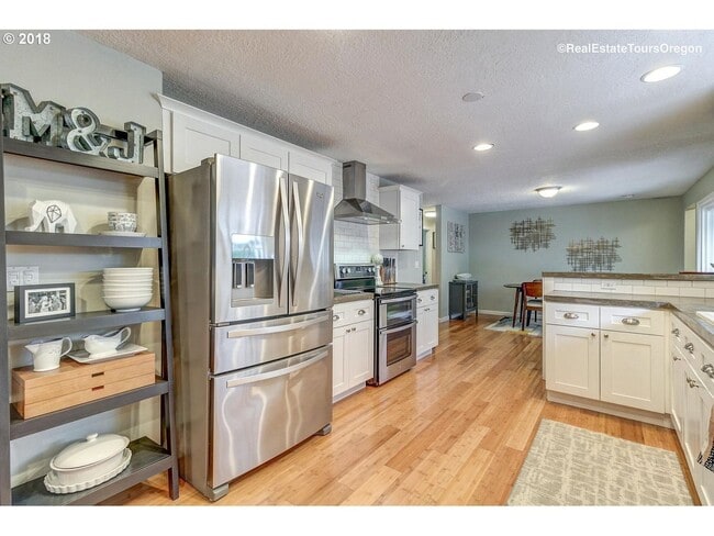 Building Photo - Spacious 4-Bedroom Home with Multiple Livi...